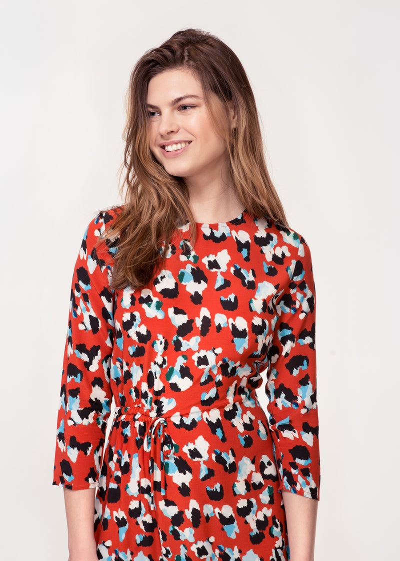 3/4 sleeve dress with asymmetric hem in a Red animal print